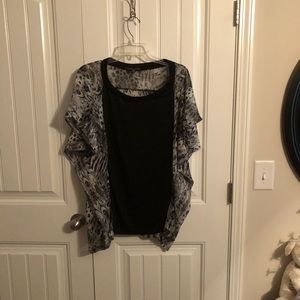 Black and print blouse. Never worn.